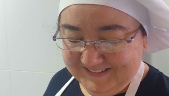 Portrait of Ana Navarro with a chef hat.