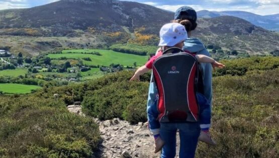 Anja hiking with her daughter with Sugarloaf Mountain in the background.