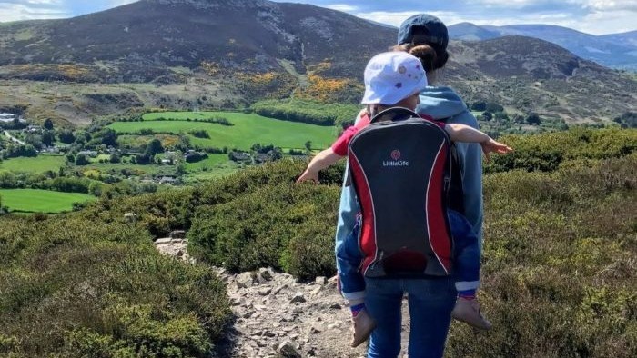 Anja hiking with her daughter with Sugarloaf Mountain in the background.