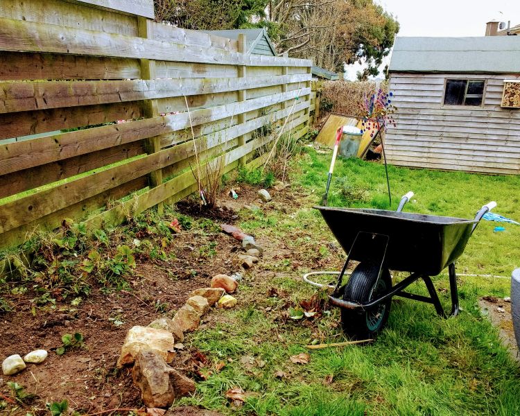 Wheelbarrow in a garden.