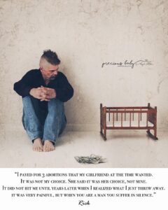 Abortion - Man looking at an empty crib.
