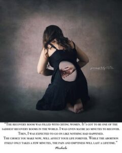 Woman holding a hole in her stomach - abortion image.