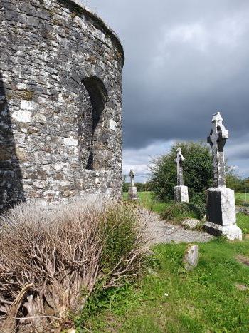 Turlough Roundtower with Celtic Crosses. Castlebar, Co. Mayo, Ireland.