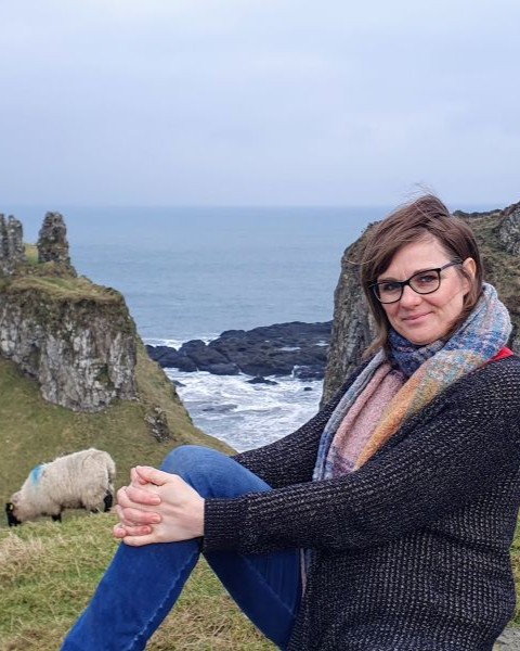 Sylvia at Cliffs with Sheep in Northern Ireland/